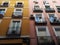 Lavapies neighborhood windows and balconies of Madrid city buildings facades