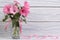 Lavatera pink flowers in a glass vase