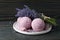 Lavender bath bombs and flowers on dark wooden table