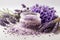 Lavender bath salt with fresh lavender flowers on a white background