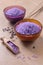 Lavender cooking salt in glass decorative plate with wooden spoon