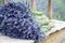 Lavender flower bouquets on a wooden old bench