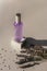 Lavender flowers and hydrolat in glass bottle on light grey background, top view. Aromatherapy concept. Copy space