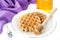 Lavender honey and Belgian waffles. Delicious dessert.