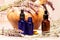 Lavender mortar and pestle and bottles of essential oils for aromatherapy