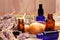 Lavender mortar and pestle and bottles of essential oils for aromatherapy