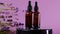Lavender oil and flowers .Essence with lavender scent on a purple background. Aromatherapy and massage. Cosmetics with