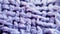 Lavender purple knitted woolen blanket fibers close up macro