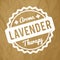 Lavender rubber stamp white on a crumpled paper brown background.