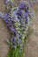 Lavender twigs on a gray wooden surface. Top view