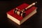 Law book with a judges gavel resting on top of the pages in a courtroom or law enforcement office