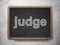 Law concept: Judge on chalkboard background