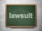 Law concept: Lawsuit on chalkboard background