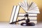 Law concept. Wooden judge gavel with law books on table in a courtroom or enforcement office.