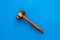 Law and court. Lawyer, attorney, judge concept. Judge gavel on blue background top view copy space