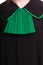 Law justice. Closeup lawyer attorney classic polish black green gown