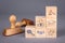 Law, Justice, Judgment and Reconciliation concept. Stamps and wooden blocks on a gray background