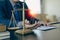 Law and Justice Lawyer working with documents and laptop, hammer, scale at wooden table in office Close-up