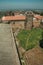 Lawn on castle central courtyard among stone walls and tower