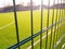 lawn field for playing minifootball behind the fence mesh