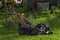 A lawn mower with a four-stroke petrol engine