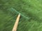 Lawn rake in motion in grass