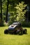 Lawn robot mows the lawn. Robotic Lawn Mower cutting grass. Ai. Generative AI