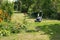 Lawnmower and wheelbarrow in the garden