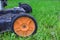 Lawnmower with yellow wheel