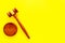 Lawyer or attorney concept. Judge gavel on yellow background top view copy space