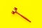 Lawyer or attorney concept. Judge gavel on yellow background top view copy space