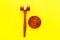 Lawyer or attorney concept. Judge gavel on yellow background top view copy space