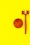 Lawyer or attorney concept. Judge gavel on yellow background top view copy space