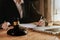 Lawyer businessman and two business partners working together in office. Businessmen sitting at desk and making notes