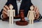 Lawyer or counselor holds figures of family, divorce or separation concept