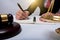 Lawyer Detail of a judge sitting at his desk, studying new laws and legislation and taking notes