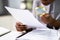 Lawyer Examining Paper Using Magnifier Glass