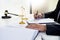 Lawyer judge reading writes the document in court at his desk