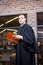 Lawyer standing near library with law book