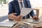 Lawyer working with client at table in office, focus