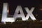 LAX sign at night welcoming travelers to Los Angeles International Airport, Los Angeles, CA