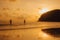 Layan Beach, Phuket, Thailand,Silhouette Two Asians standing fishing at the sea