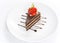 Layer dark chocolate cake garnishing with sliced red strawberry