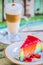 Layer rainbow cakes and cappuccino coffee