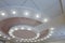 Layered ceiling with embedded lights and stretched ceiling inlay