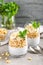 Layered chia pudding parfait with banana, sweet wheat with honey and yogurt