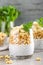 Layered chia pudding parfait with banana, sweet wheat with honey and yogurt