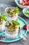 Layered chia pudding parfait with kiwi fruit, pomegranate, granola and yogurt