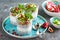 Layered chia pudding parfait with kiwi fruit, pomegranate, granola and yogurt