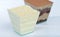 Layered delicious milk chocolate dessert with cream cheese in a